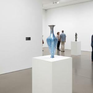 Blue vase displayed in art gallery 