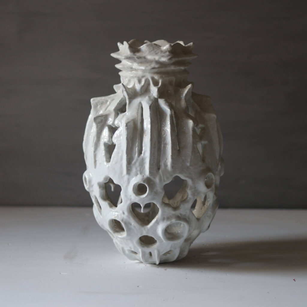 Hand-sculpted white rose and heart-shaped sculptural vase, unique mineral clay art.