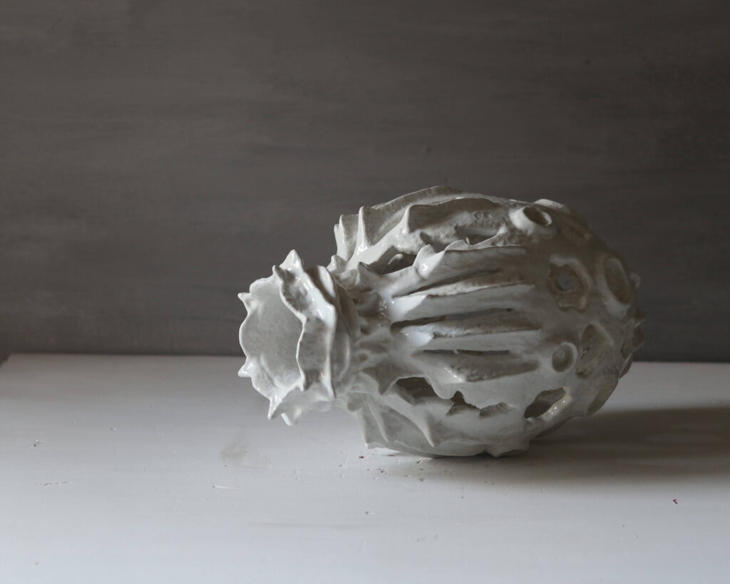 Hand-sculpted white rose and heart-shaped sculptural vase, unique mineral clay art.