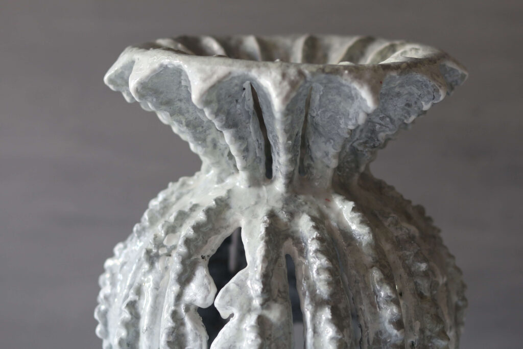 Unique grey and white textured sculptural vase, handcrafted from mineral-base clay.