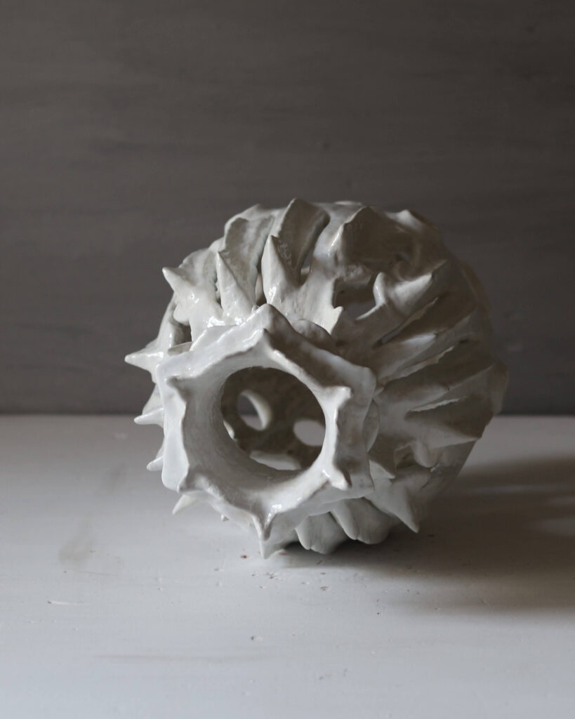 Hand-sculpted white rose and heart-shaped sculptural vase, unique mineral clay art.